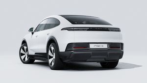Exterior view of Cayenne Coupé Electric showing the back and left side of the car