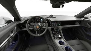 Interior view showing the steering wheel and dashboard of Taycan 4S