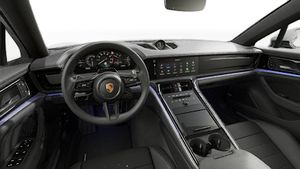 Interior view showing the steering wheel and dashboard of Panamera 4 E-Hybrid