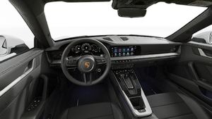 Interior view showing the steering wheel and dashboard of 911 Carrera