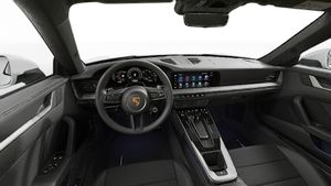 Interior view showing the steering wheel and dashboard of 911 Carrera 4S