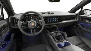Interior view showing the steering wheel and dashboard of Cayenne E-Hybrid Black Edition