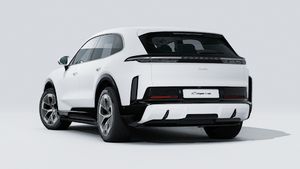 Exterior view of Cayenne Turbo Electric showing the back and left side of the car