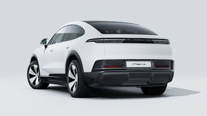 Exterior view of Cayenne Coupé Electric showing the back and left side of the car