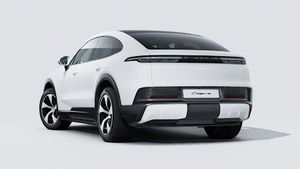 Exterior view of Cayenne S Coupé Electric showing the back and left side of the car