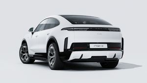 Exterior view of Cayenne Turbo Coupé Electric showing the back and left side of the car