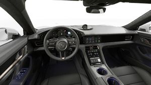 Interior view showing the steering wheel and dashboard of Taycan Turbo S
