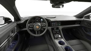 Interior view showing the steering wheel and dashboard of Taycan Black Edition