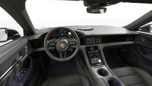 Interior view showing the steering wheel and dashboard of Taycan 4 Black Edition