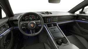 Interior view showing the steering wheel and dashboard of Panamera 4 E-Hybrid