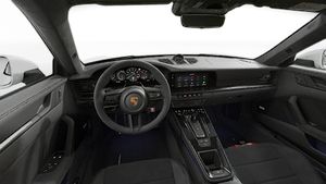 Interior view showing the steering wheel and dashboard of 911 Carrera GTS