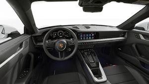 Interior view showing the steering wheel and dashboard of 911 Carrera 4S