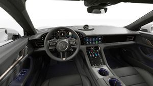 Interior view showing the steering wheel and dashboard of Taycan Turbo
