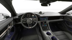 Interior view showing the steering wheel and dashboard of Taycan Turbo S