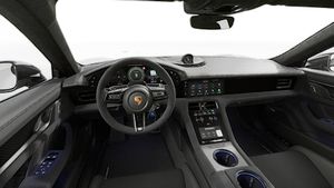 Interior view showing the steering wheel and dashboard of Taycan Turbo GT